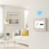 Sleek wireless alarm panel with Wi-Fi signal in a modern, clean home interior.