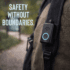 Belle mobile medical alert device clipped to a backpack strap during an outdoor walk, promoting safety without boundaries.