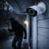 Outdoor security camera capturing a masked intruder approaching a home at night, demonstrating visual verification for faster police response.